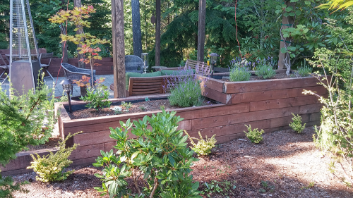 A hardscaped wall and paved patio